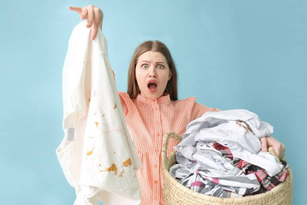 como tirar graxa de roupa